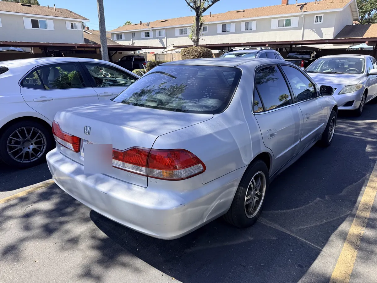 Light blue Honda Accord sedan, rear three-quarter view