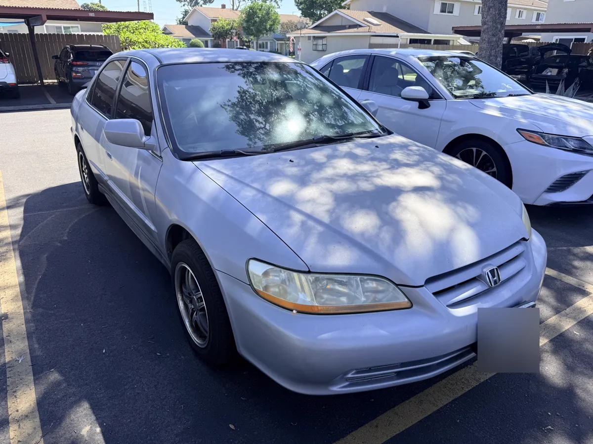 Light blue Honda Accord sedan, side view