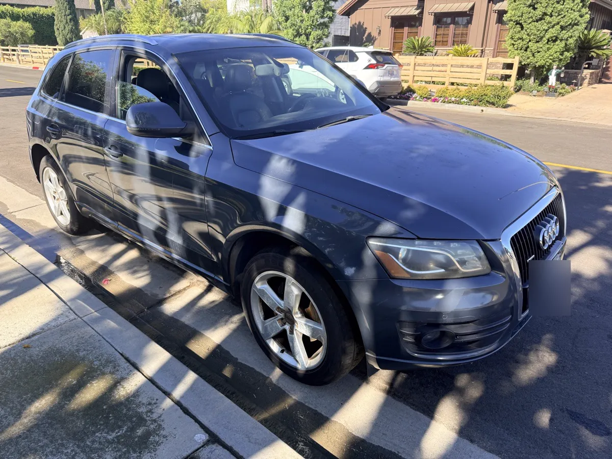 Gray Audi Q5 SUV, front side view