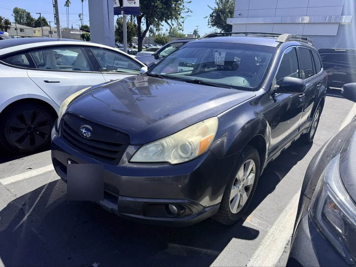 Dark gray Subaru Outback, front three-quarter view