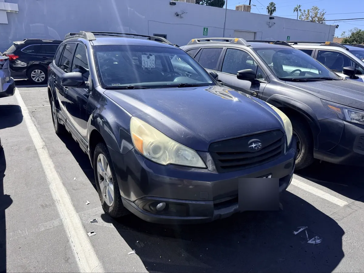Dark gray Subaru Outback, alternate front three-quarter view